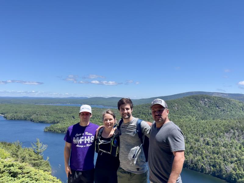 Aimee and her family hiking in Maine